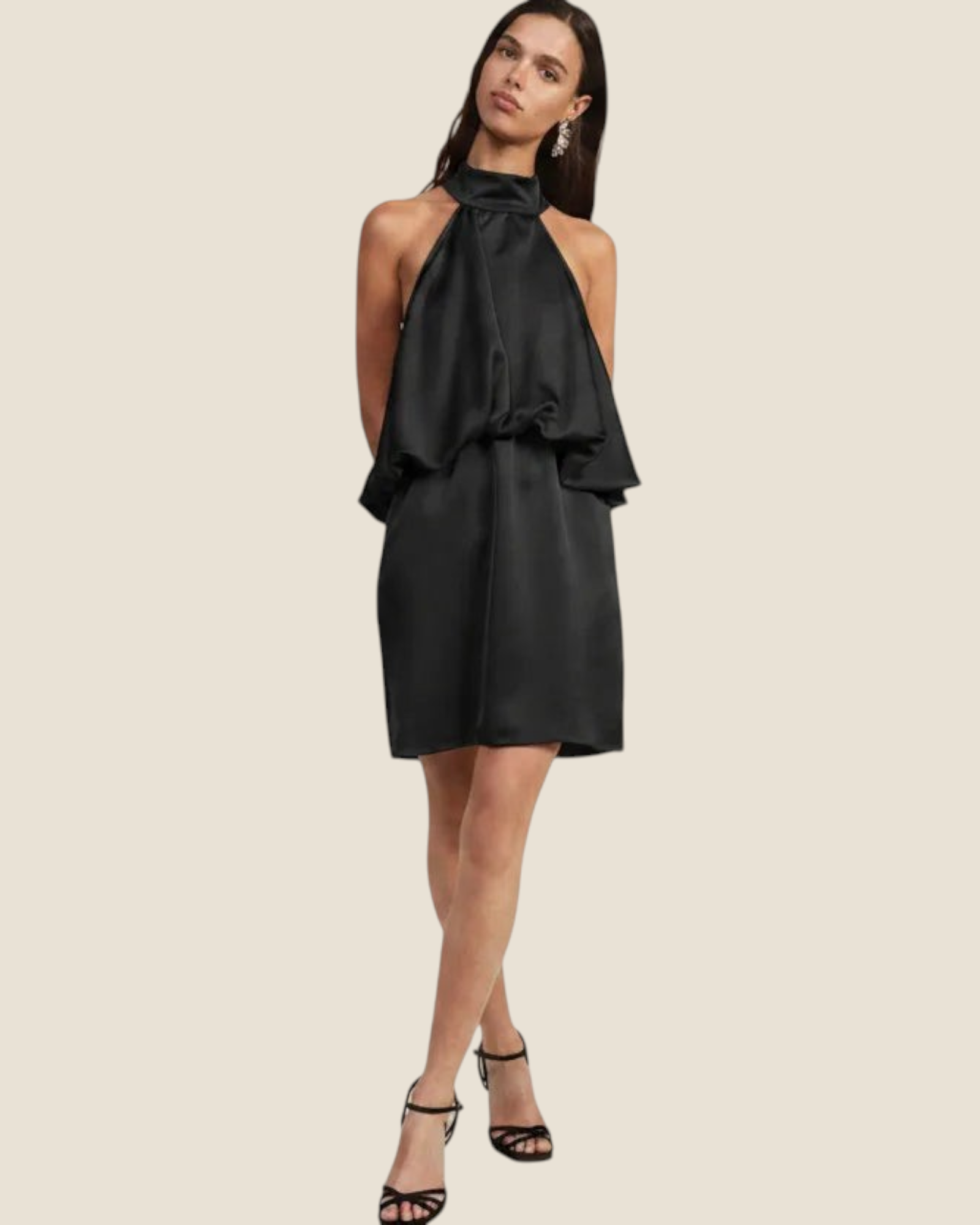 Model wearing a black Madison Shop short halter neck dress with a ruffled hem and fluid fit against a neutral background