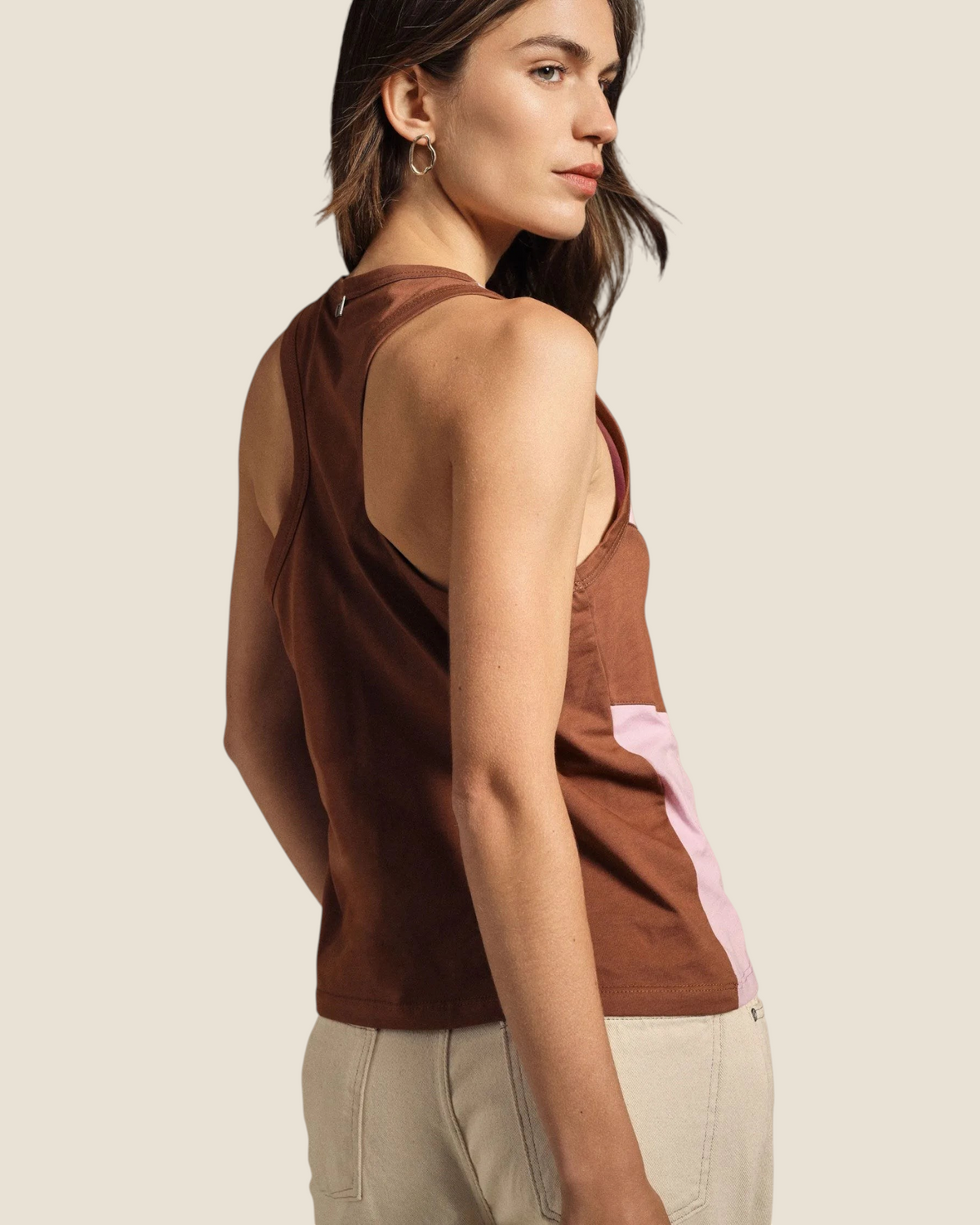 Madison Shop Dixie sleeveless cotton tank top in brown and pink with a racerback design worn by a model.