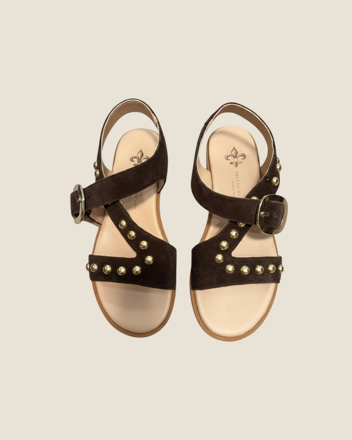 Madison Shop Helena Backer dark brown suede flat sandals with gold spherical studs and ankle strap with large buckle.