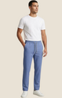 Madison Shop Over/D slim fit blue chino jogger pants with elastic drawstring waist worn by a male model