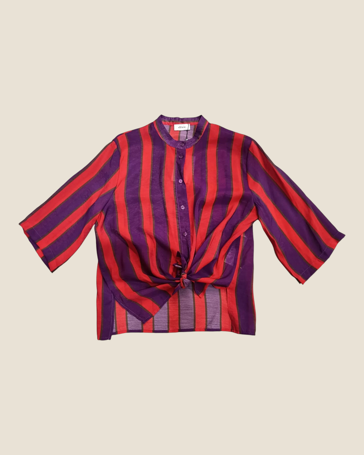 Madison Shop Dixie striped shirt with mandarin collar, three-quarter sleeves, and front tie detail in red and purple.