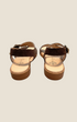 Madison Shop Helena Backer dark brown suede flat sandals with gold studs and ankle strap, rear view.
