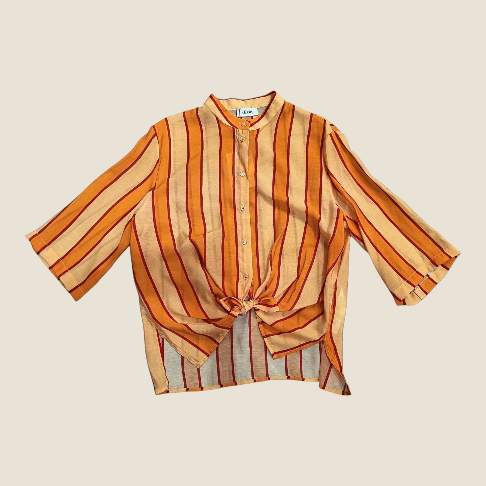 Madison Shop Dixie striped shirt with mandarin collar, three-quarter sleeves, and front tie detail in orange tones.