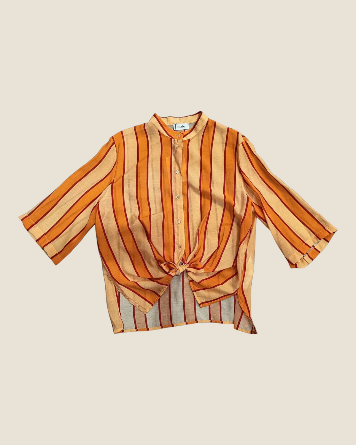 Madison Shop Dixie striped shirt with mandarin collar, three-quarter sleeves, and front tie detail in orange tones.