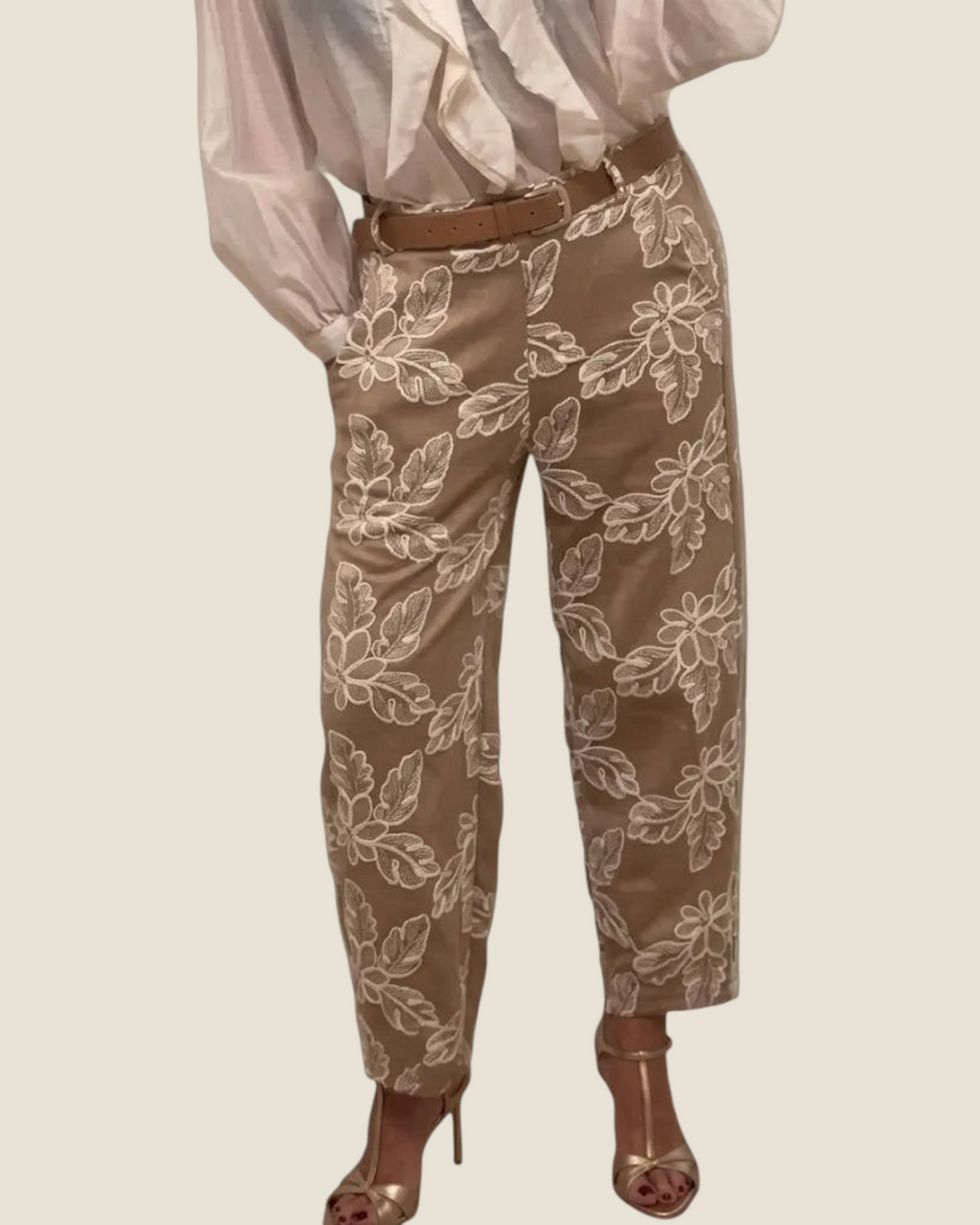 Madison Shop straight leg trousers in beige with white floral embroidery and a brown belt, styled with a white blouse.