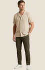 Madison Shop beige short-sleeve shirt with a camp collar, worn by a man with olive trousers and white sneakers.