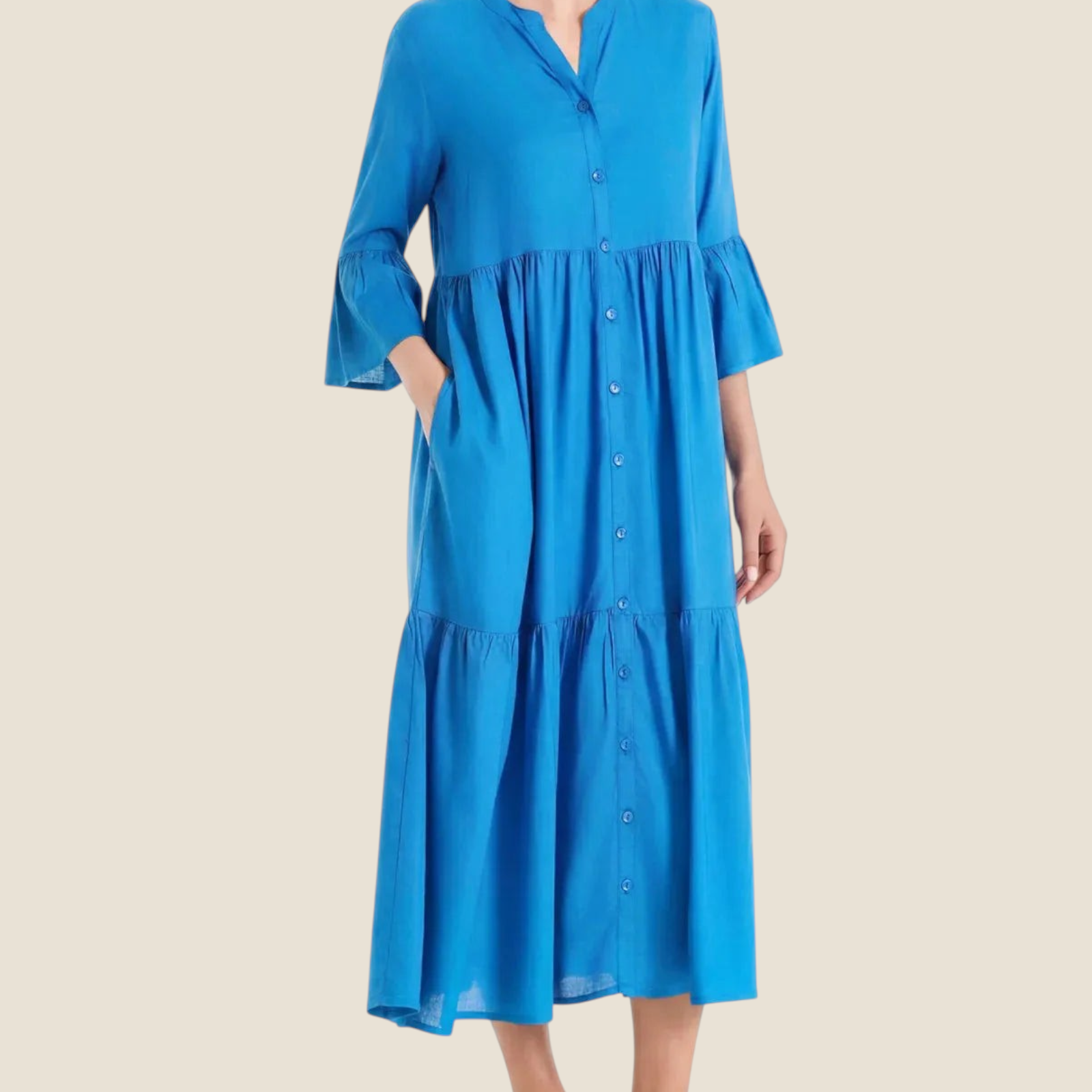 Madison Shop blue long tiered dress in slub muslin with button-down front, elbow-length ruffled sleeves, and pockets.