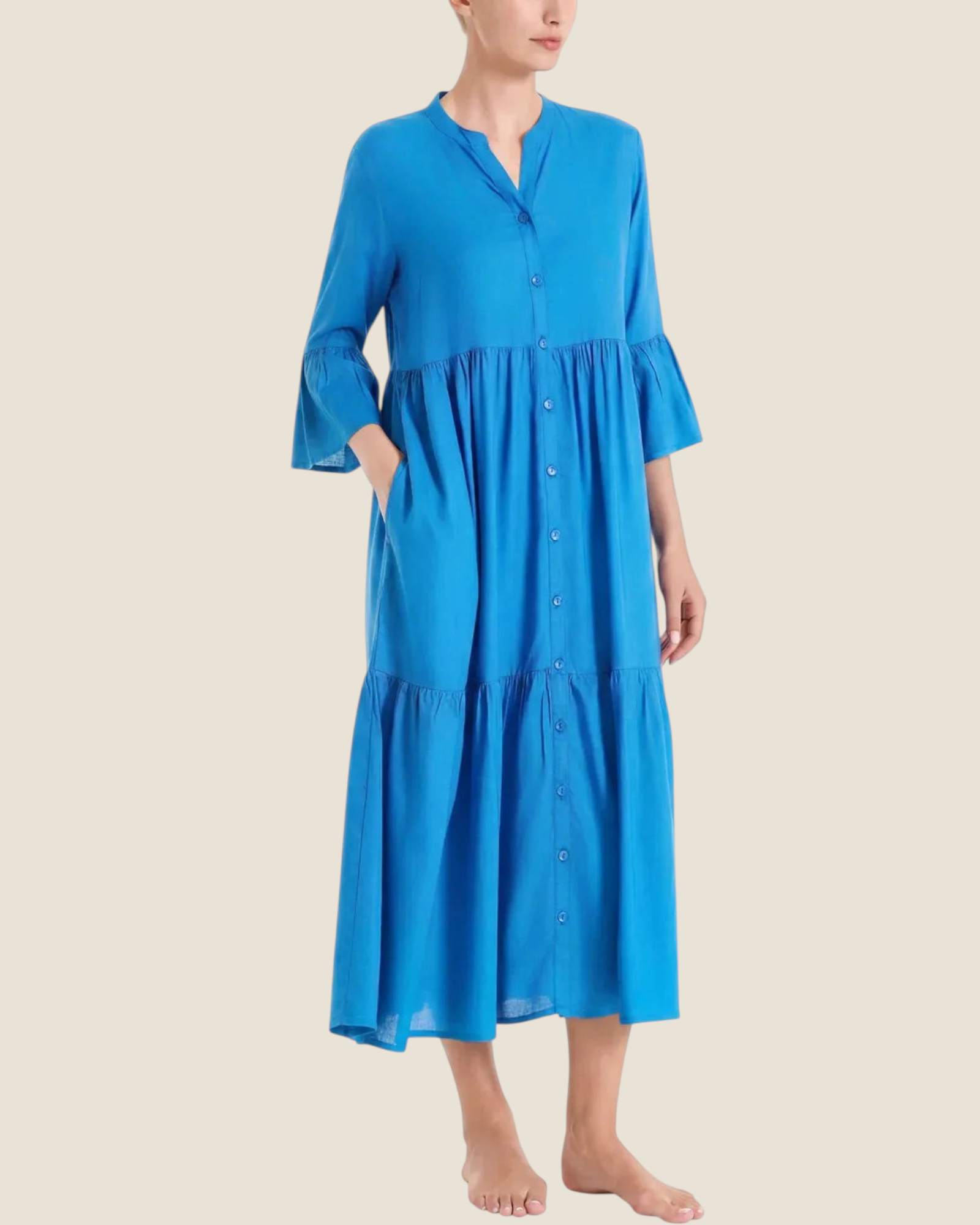 Madison Shop blue long tiered dress in slub muslin with button-down front, elbow-length ruffled sleeves, and pockets.