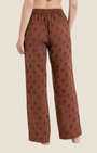 Madison Shop brown wide leg trousers in cotton sangallo with an elasticated waist and floral embroidery, back view.