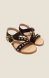 Madison Shop dark brown suede flat sandals with gold spherical studs, crossover straps, and a large buckle closure.