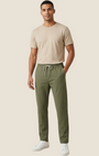 Madison Shop Over/D slim fit olive green chino jogger pants with elastic drawstring waist on a male model