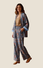 Madison Shop Dafne botanical print kimono and palazzo pants set in blue with striped lining on a smiling model