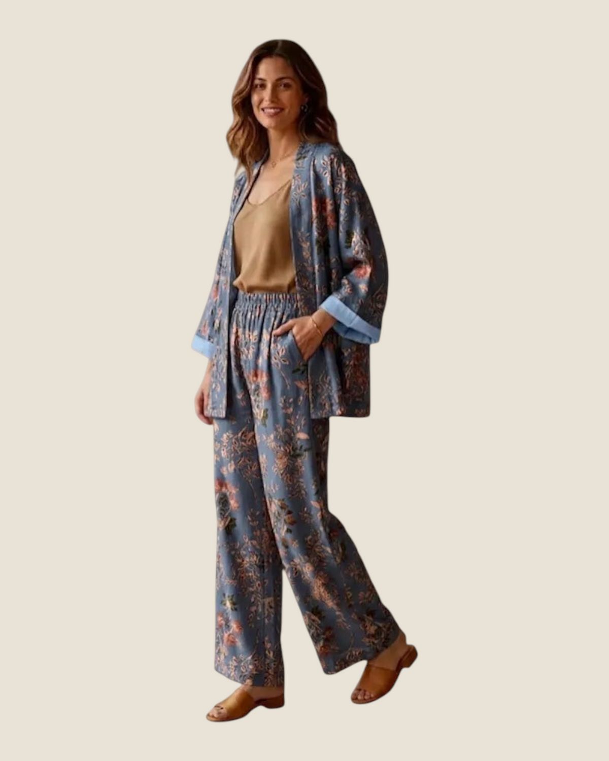 Madison Shop Dafne botanical print kimono and palazzo pants set in blue with striped lining on a smiling model