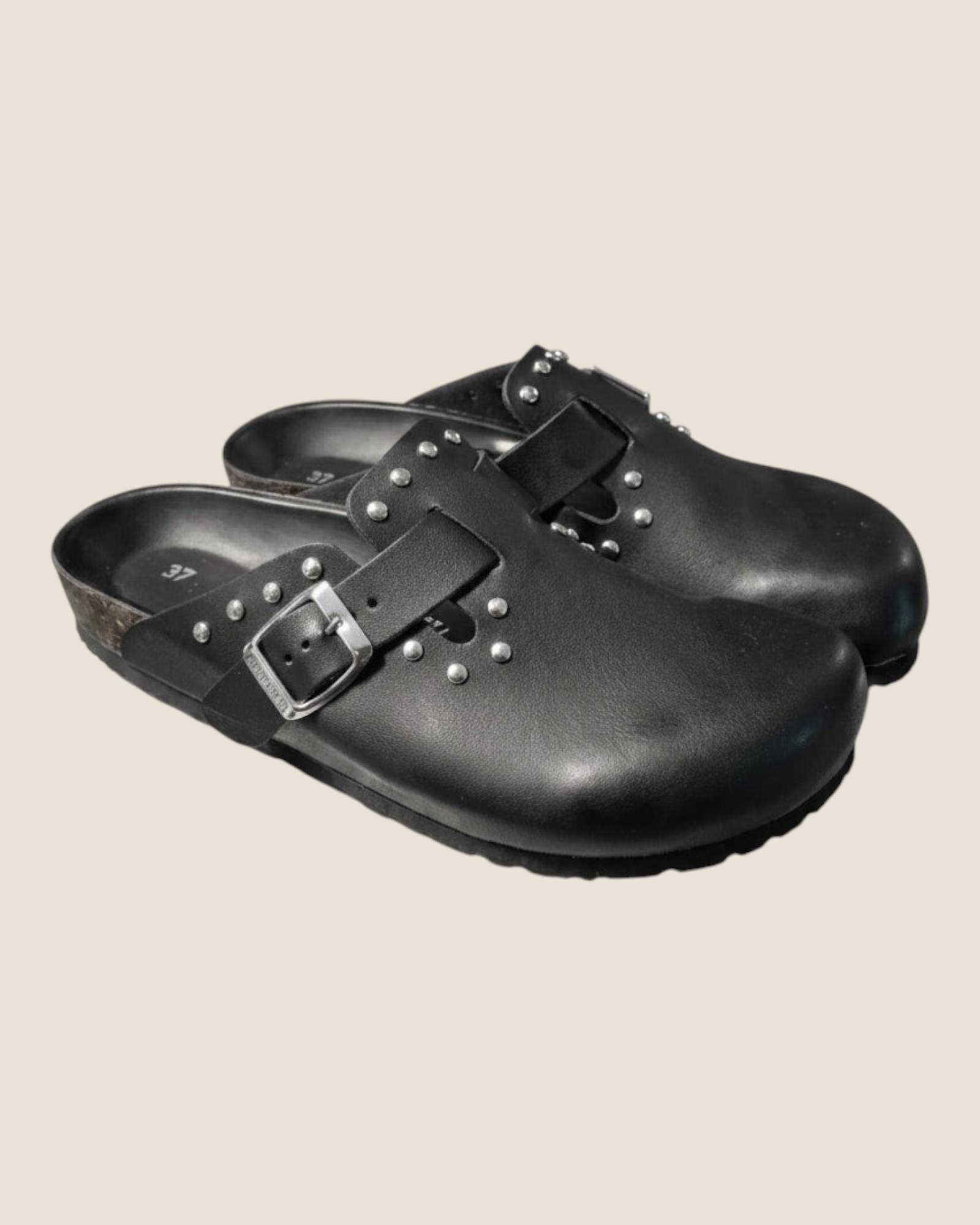 Madison Shop Rafting Goldstar black glossy leather clogs for women with decorative studs and adjustable metal buckle.